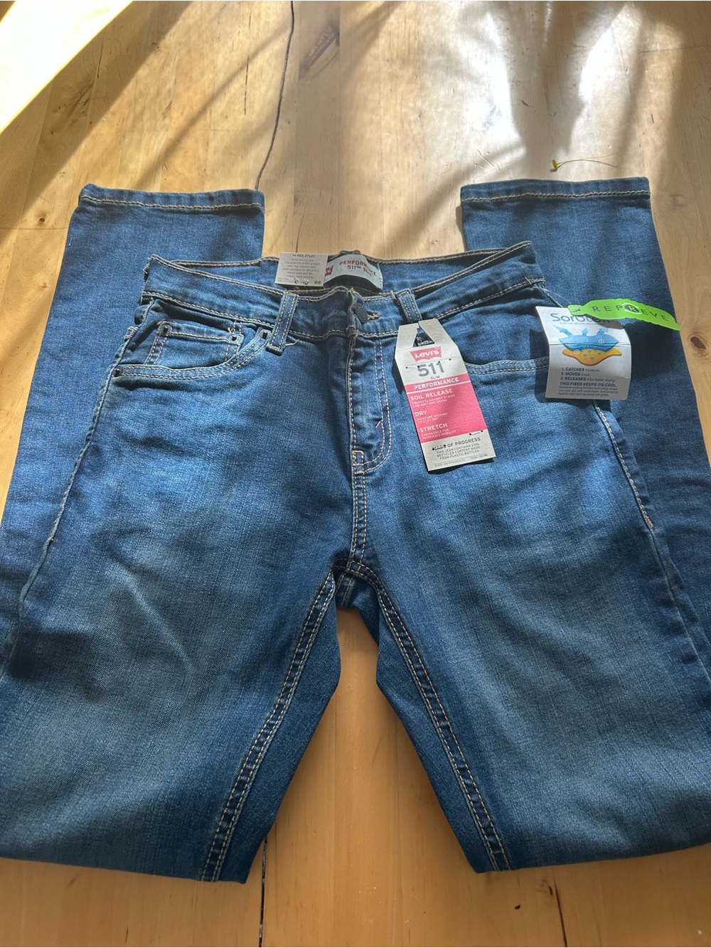 new-with-tags Levi's 511 Slim Performance jeans in  Size 27 wash blue.